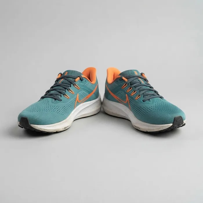 Teal and orange athletic running shoes, gently used